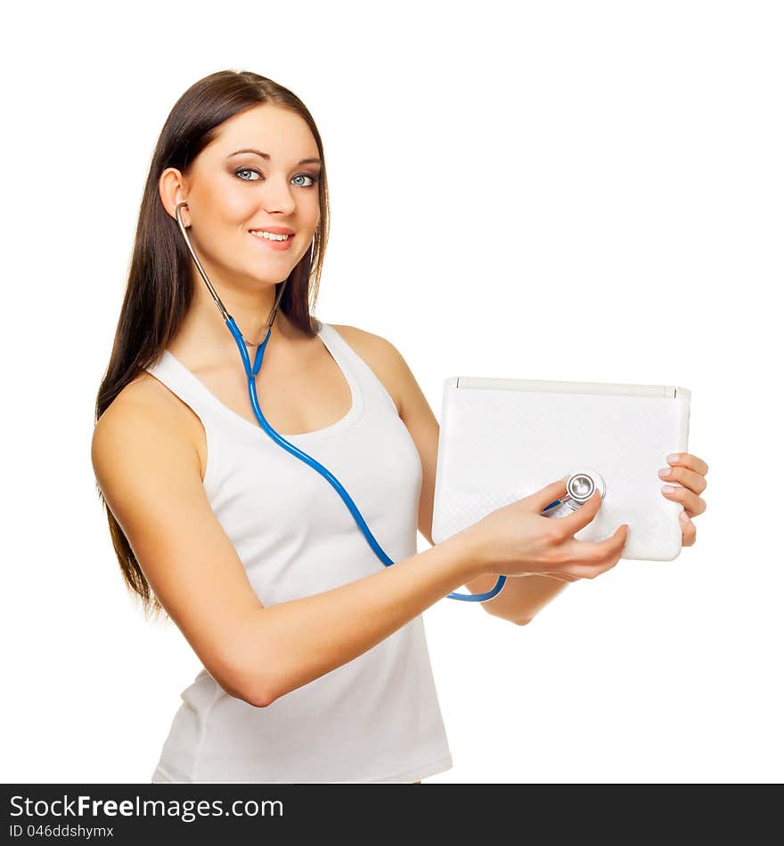 The young woman test the laptop with a tonometer on a white background