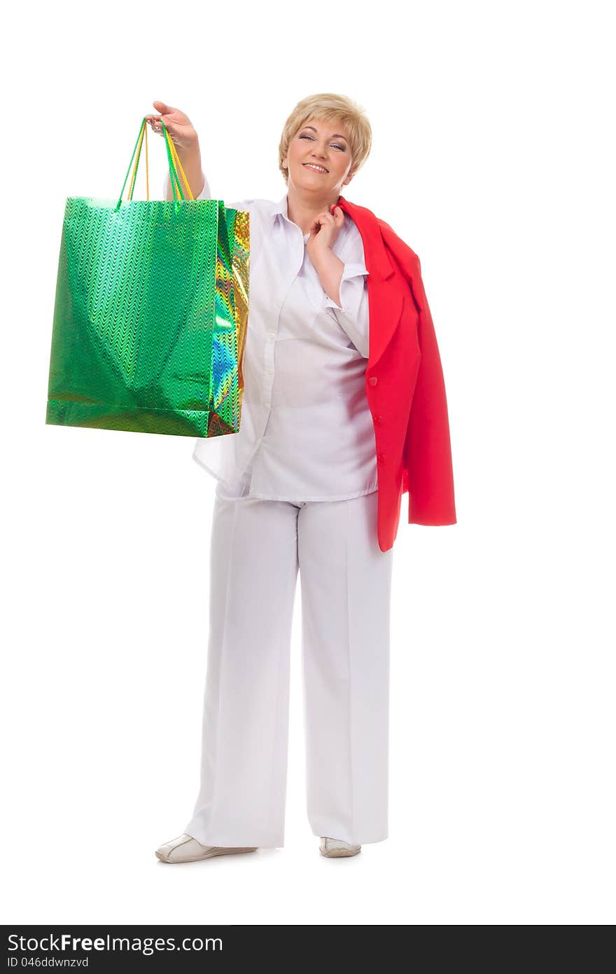 Portrait of a smiling adult woman with shopping bags isolated against white background. Portrait of a smiling adult woman with shopping bags isolated against white background