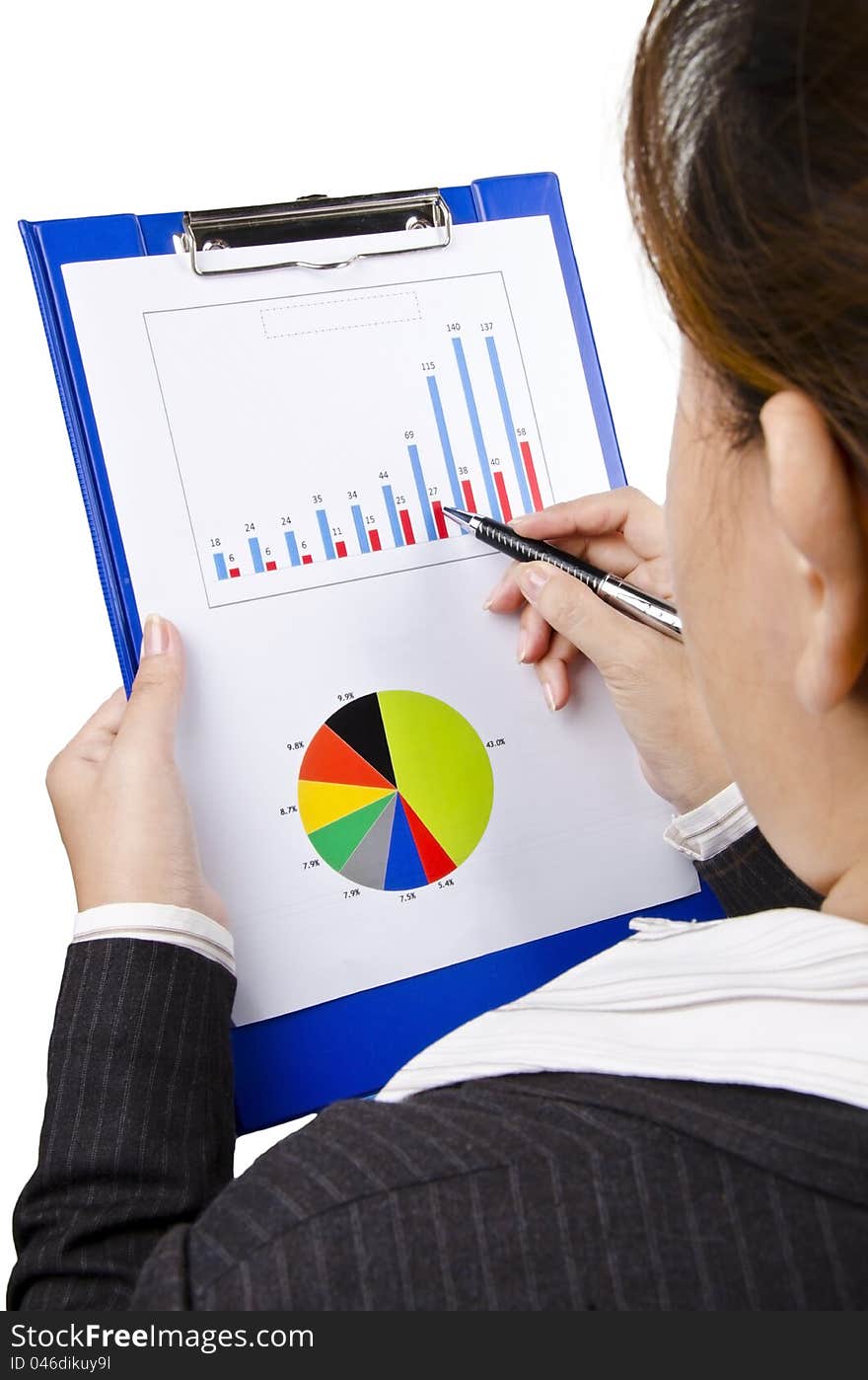 A portrait of business woman looking at business chart. A portrait of business woman looking at business chart