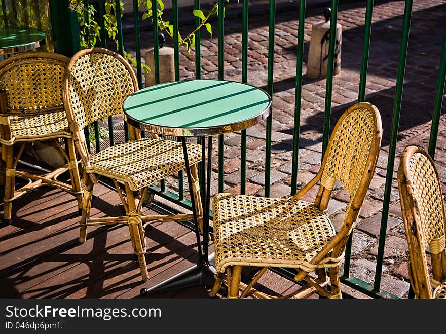 Table and Chairs at pavement cafe in Montmartre, Paris