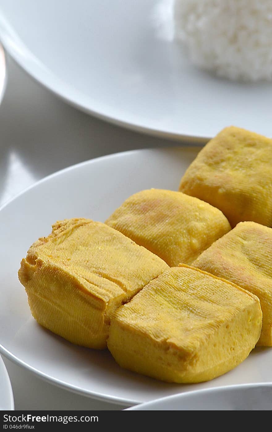 Fried tofu (soybean curd) usually served as additional food to complete the main menu in many tropical and asian traditional food. Fried tofu (soybean curd) usually served as additional food to complete the main menu in many tropical and asian traditional food