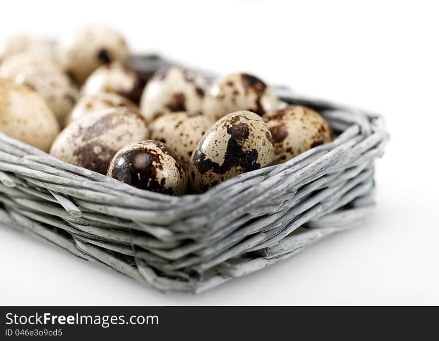 Quail eggs into the wicker basket