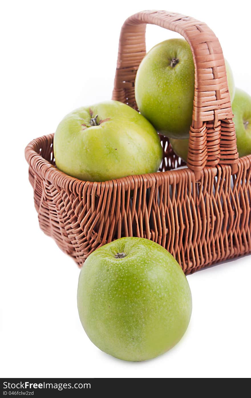 Ripe green apples in basket