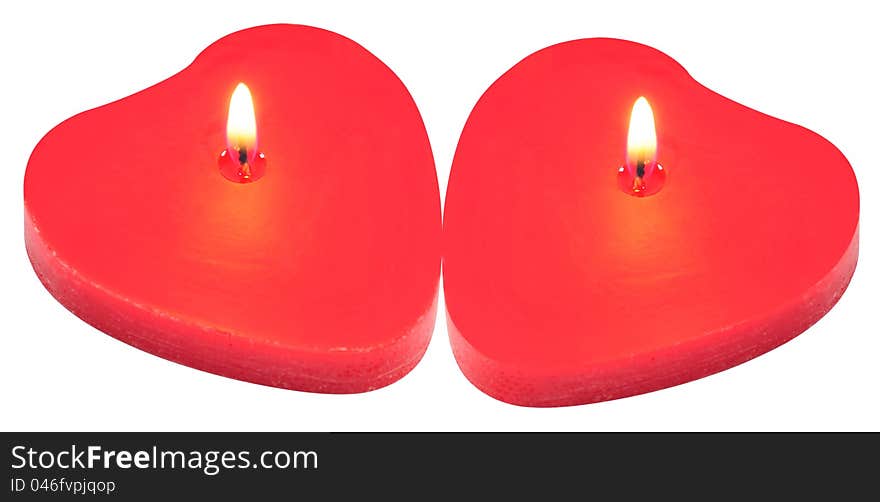 Lit red candles over white background. Lit red candles over white background.