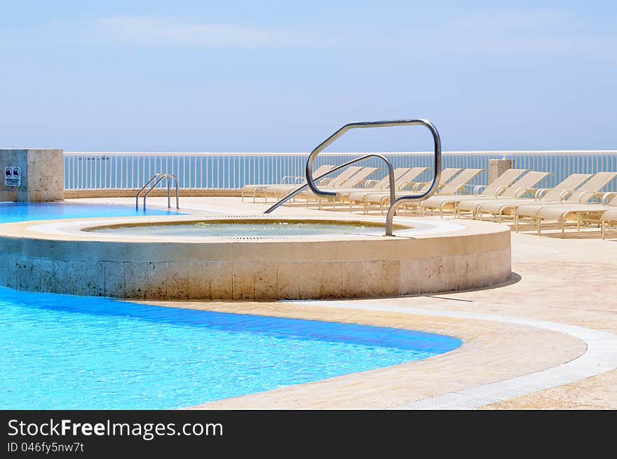 Swimming pool in a sunny day. Swimming pool in a sunny day.