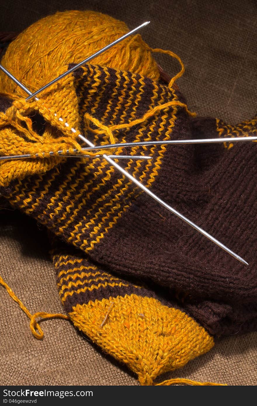 Woollen Scarf With  Knitting Needles.