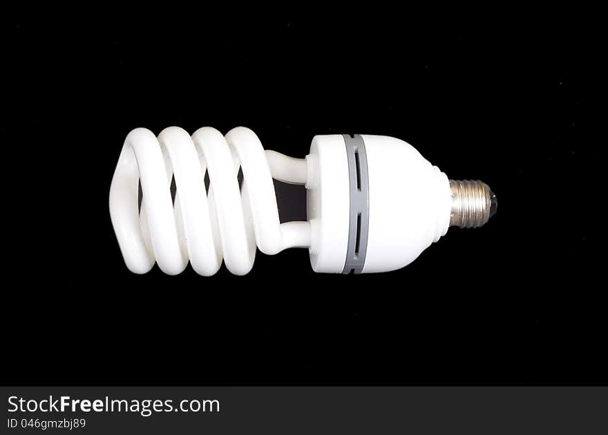 Energy-saving lamp isolated on black bac