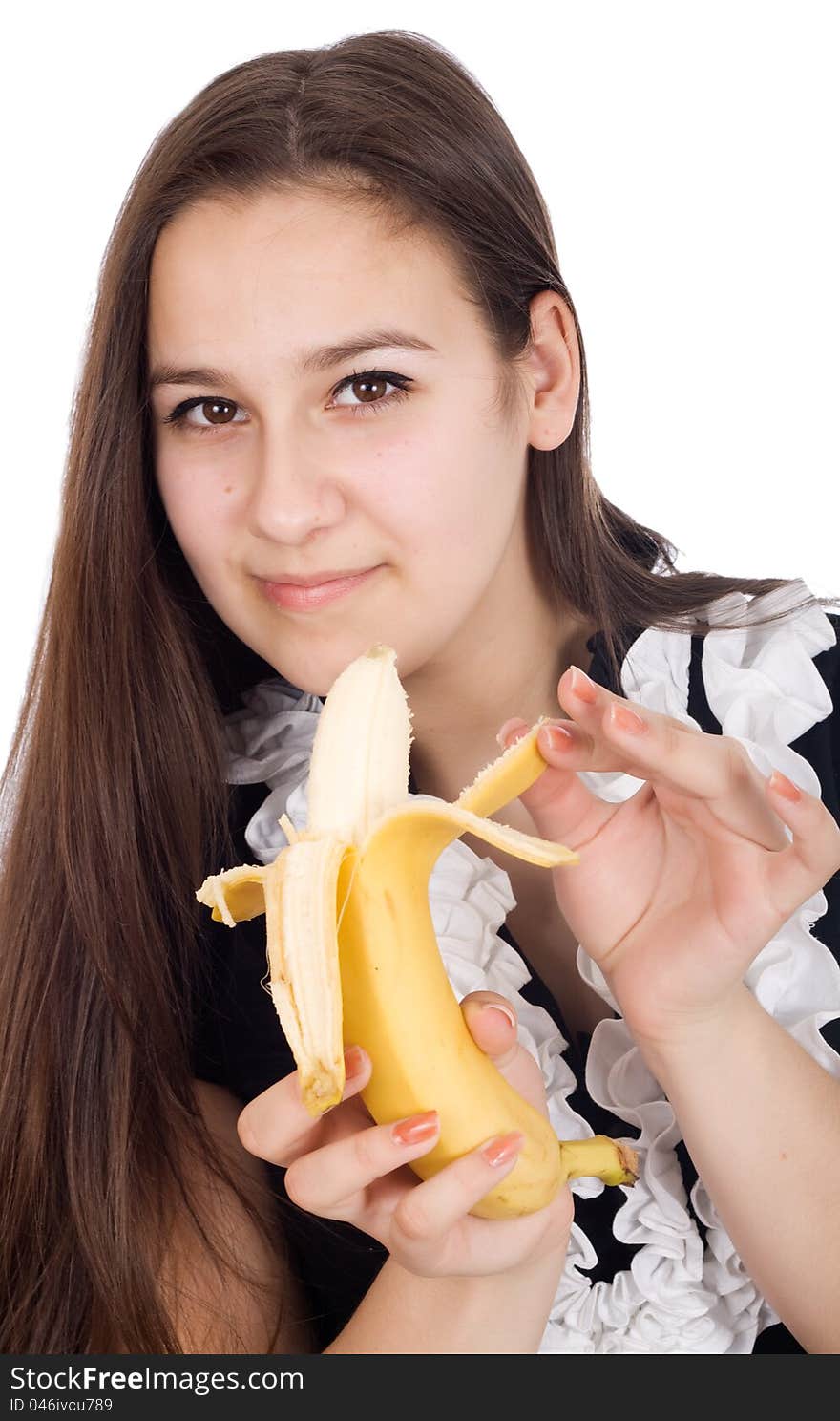 Young beautiful and healthy woman is eating a banana. Young beautiful and healthy woman is eating a banana