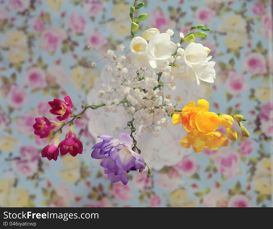 Gentle spring bouquet in a vase on a color cloth. Gentle spring bouquet in a vase on a color cloth