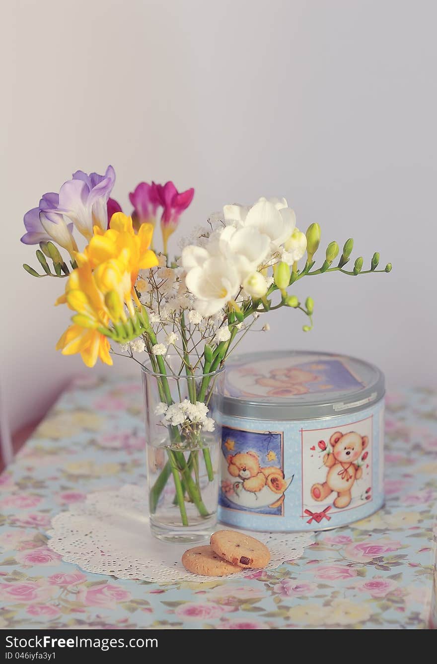 Gentle spring bouquet in a vase on a color cloth. Gentle spring bouquet in a vase on a color cloth