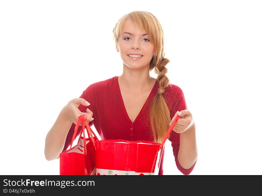 Beautiful young woman with a shopping package isolated over white background