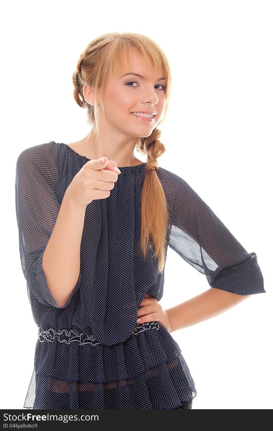 Young woman points fingers forward. isolated on white background.