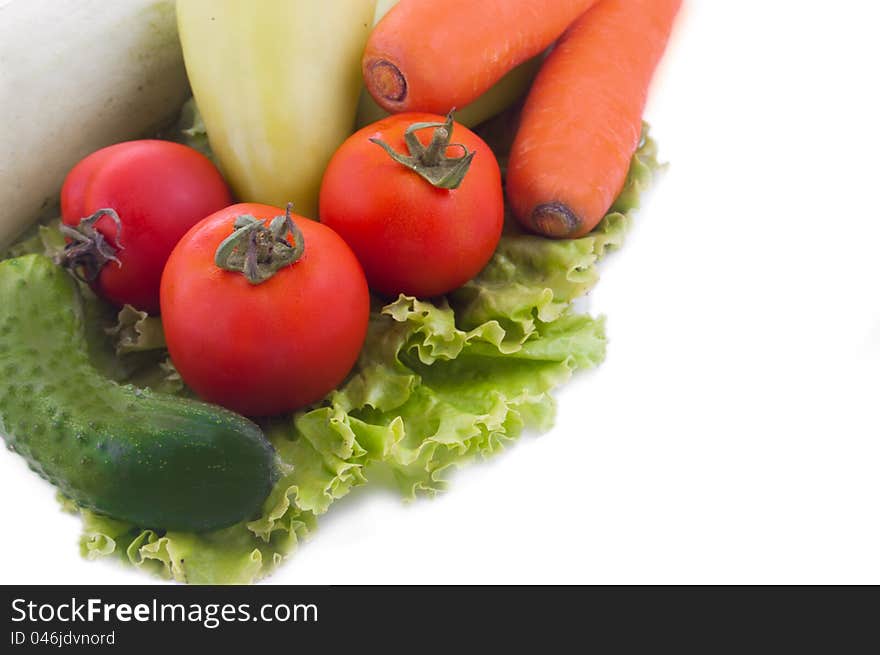 Carrot, cucumbers, tomatoes, peppers on white. Carrot, cucumbers, tomatoes, peppers on white