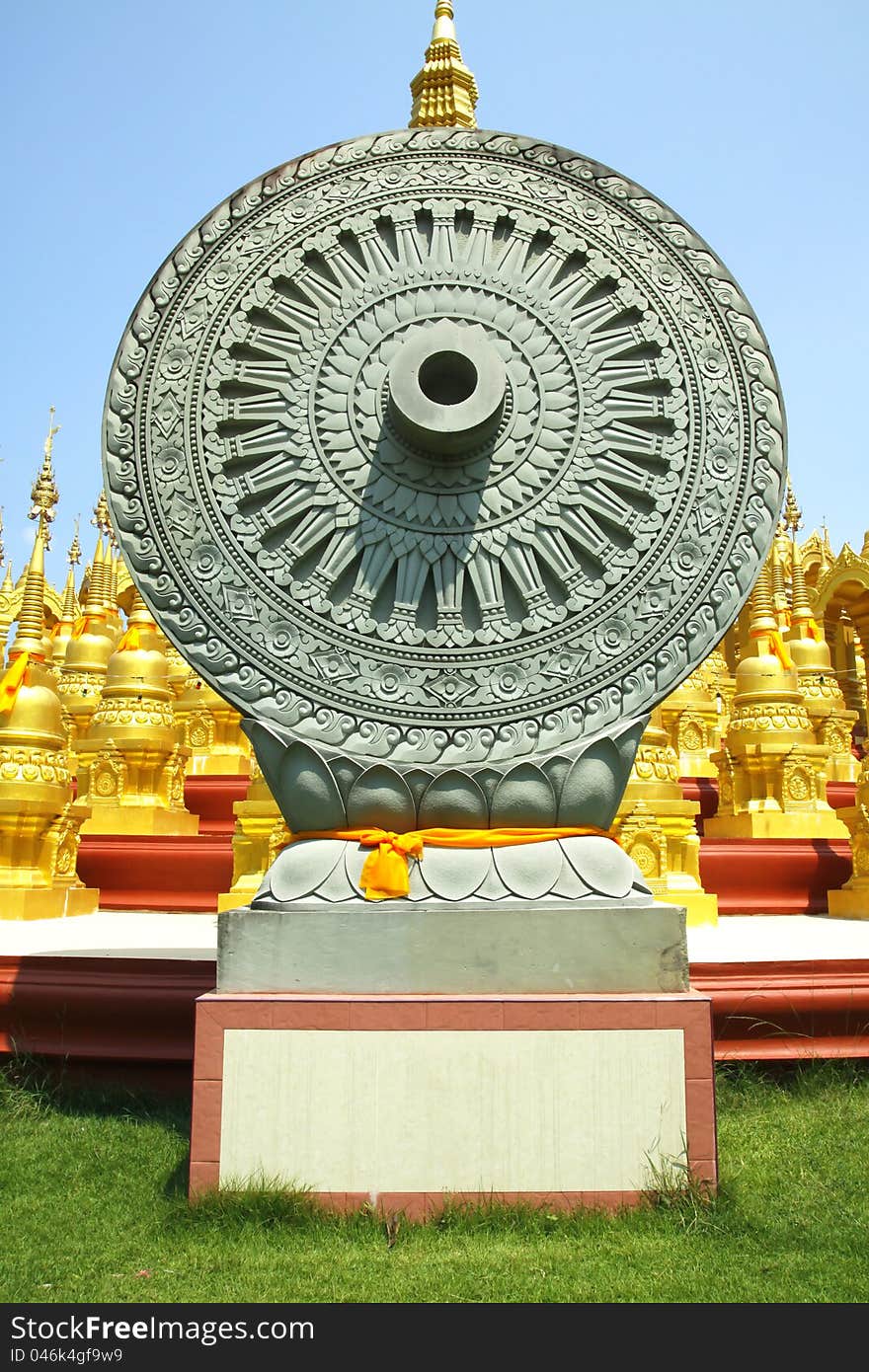 Wheel of Dhamma is symbol of Buddhism at WAT-PA-SAWANG-BUN ,500 pagodas Buddhism temple at Saraburi,Thailand. Wheel of Dhamma is symbol of Buddhism at WAT-PA-SAWANG-BUN ,500 pagodas Buddhism temple at Saraburi,Thailand