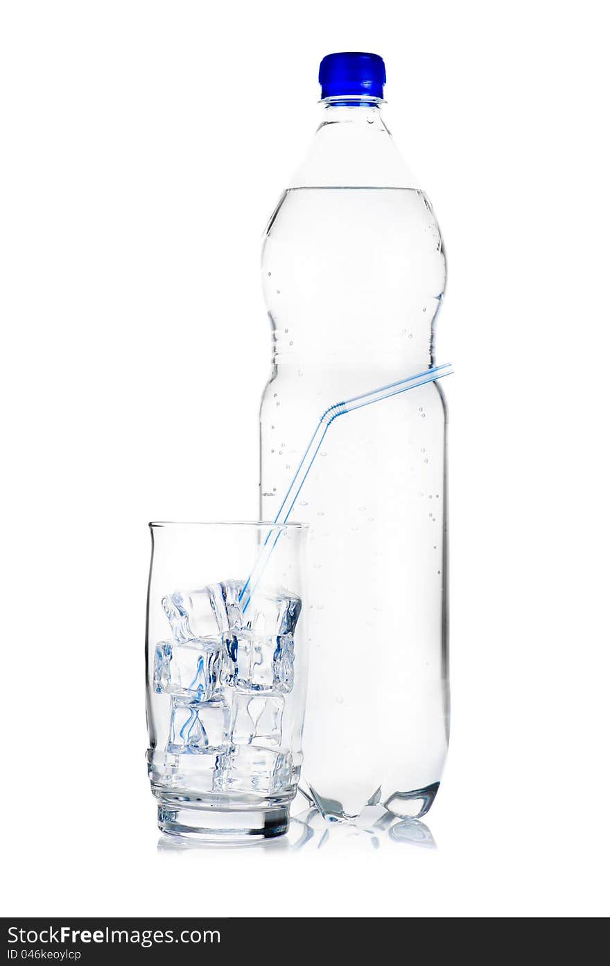 Blue plastic bottle of mineral water and glass with ice cubes and straw on white background