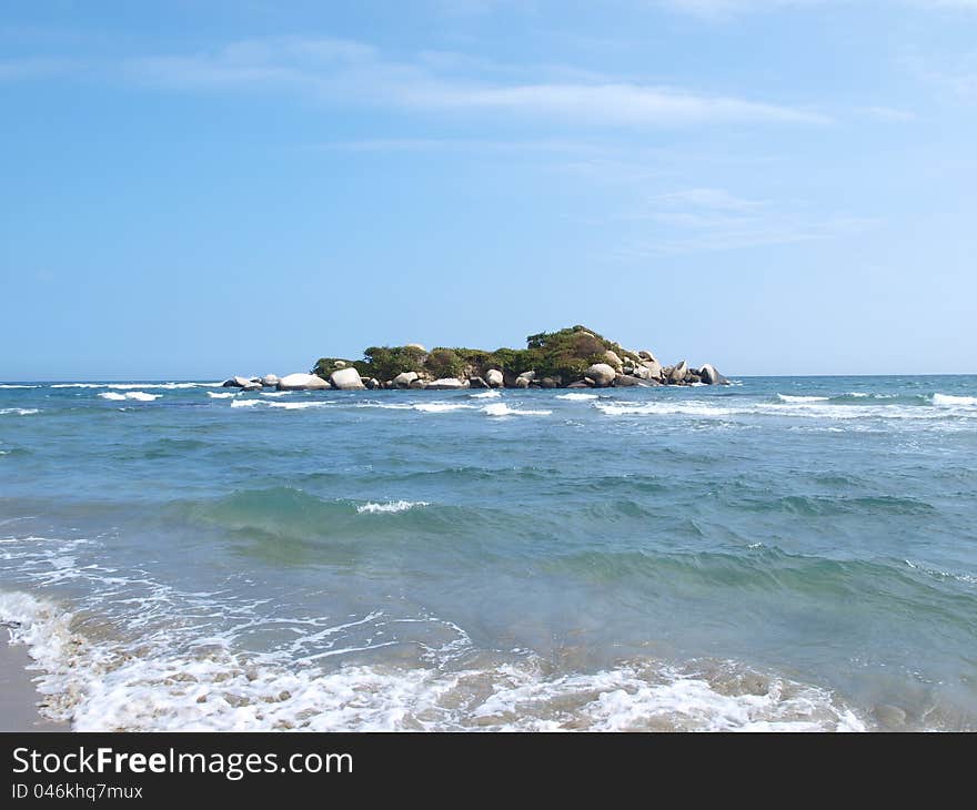 Island in blue ocean water