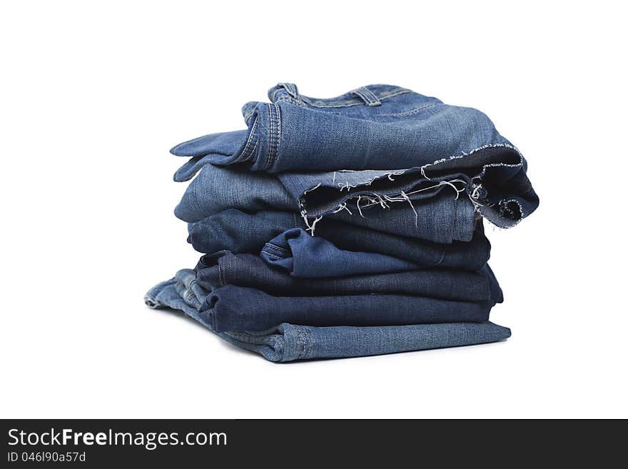 Stack Of Blue Jeans Isolated On White