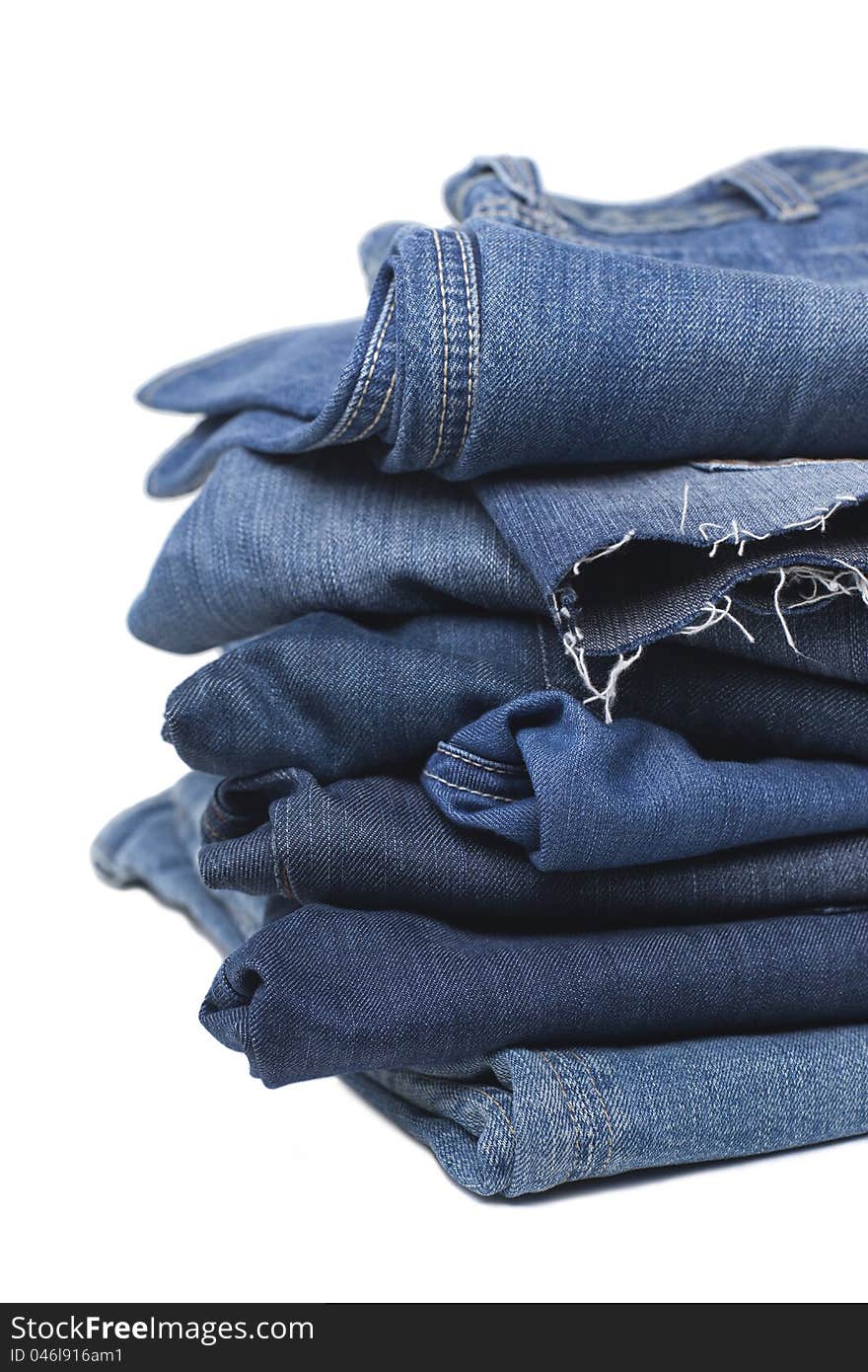 Stack Of Blue Jeans Isolated On White