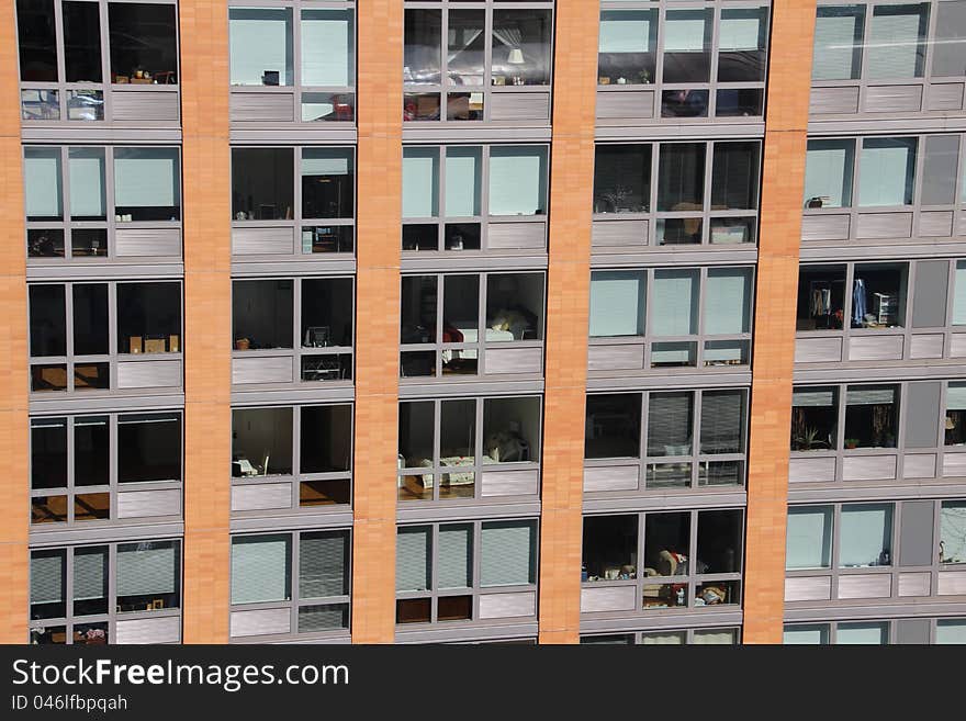 Windows of several apartments in a Manhattan's high rise building