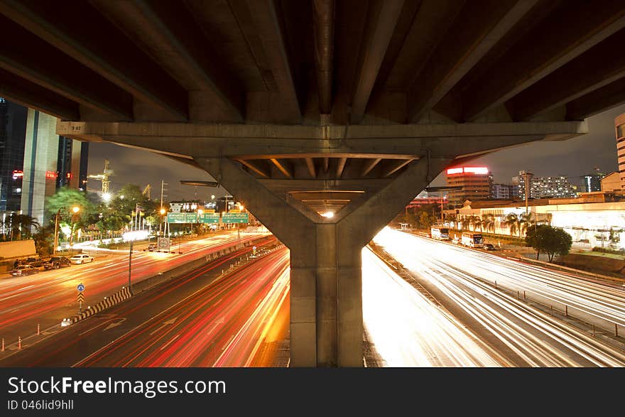 Lights on at night. In the city the car is running. Lights on at night. In the city the car is running.