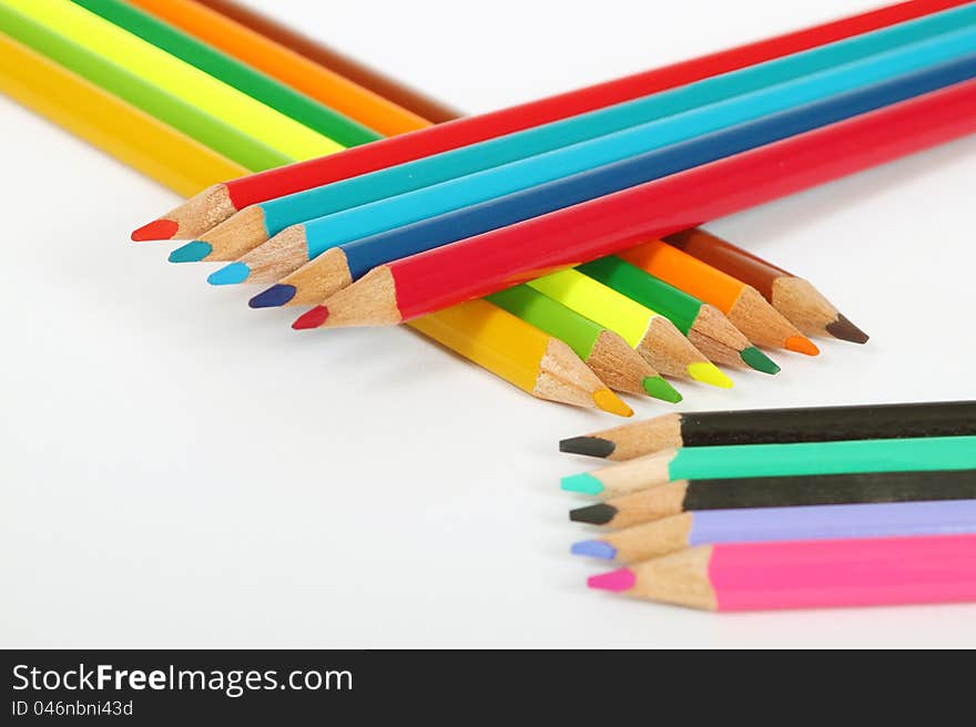 Aranged wooden color pens on white background. Aranged wooden color pens on white background