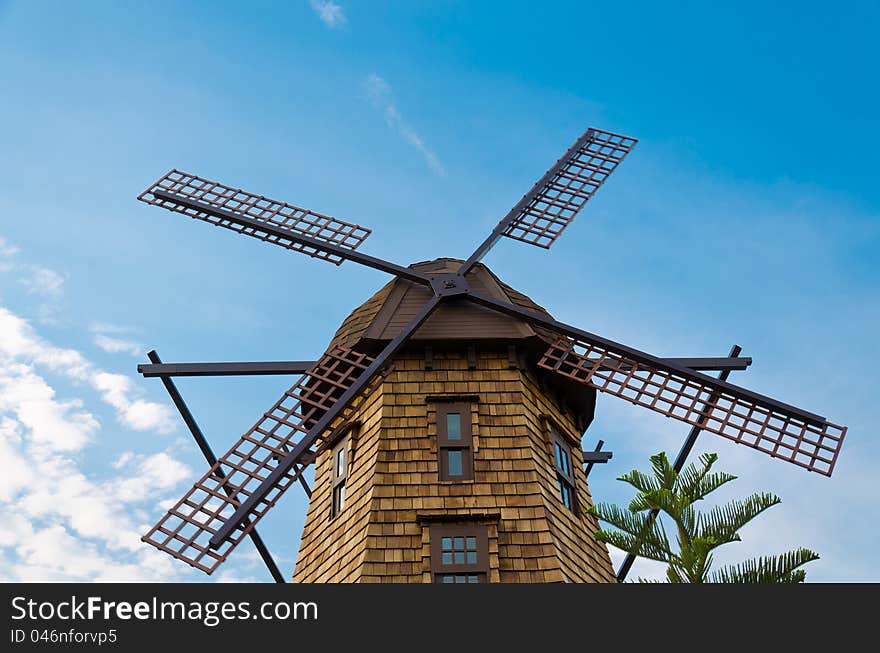 Windmill standing in the blue sky creating a nice aerial view. Windmill standing in the blue sky creating a nice aerial view.