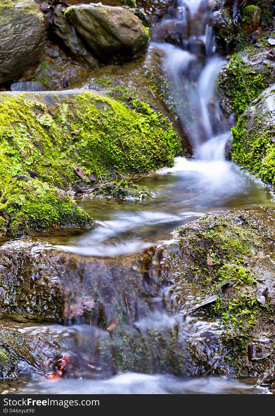 Beautiful veil cascading waterfalls, mossy rocks