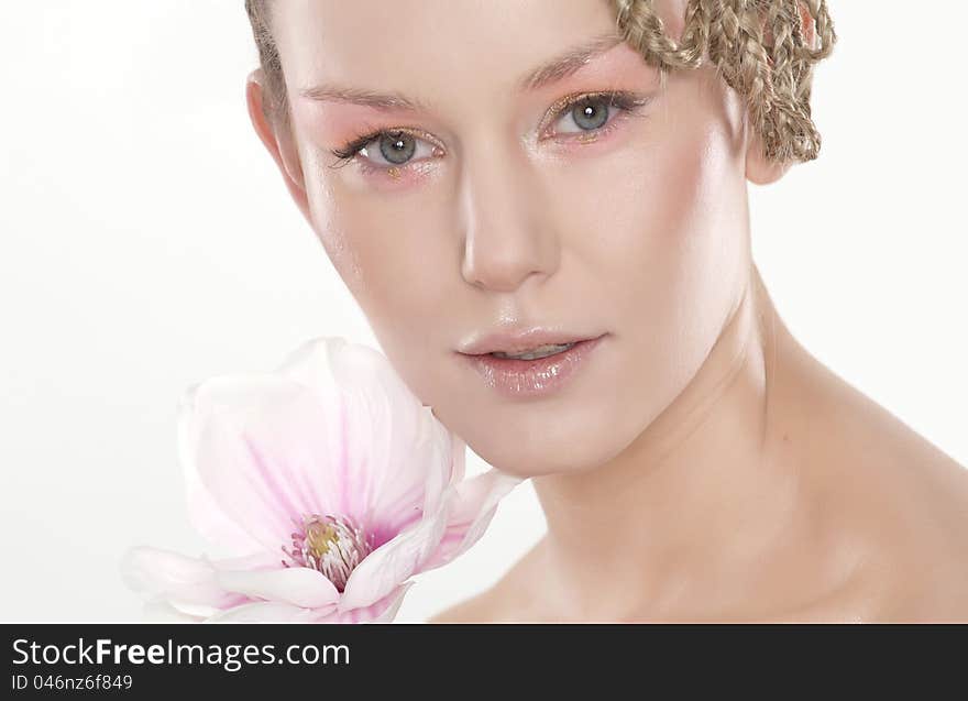 Beautiful young woman with lily flower