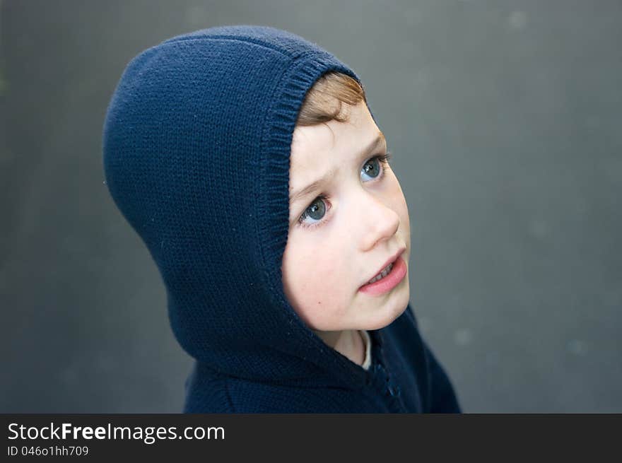 Boy in navy blue hood