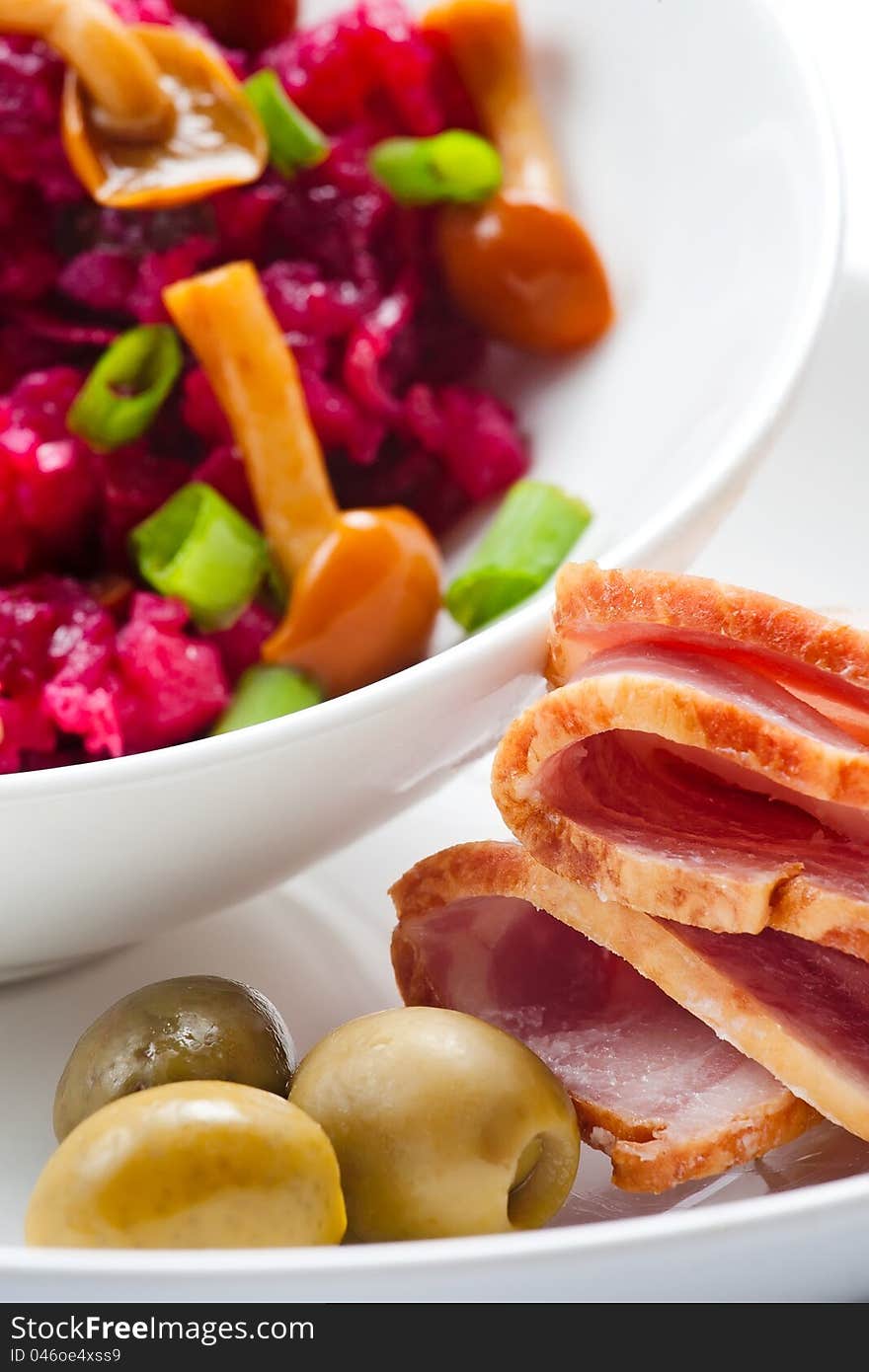 Ham olives and beet salad with mushrooms. Ham olives and beet salad with mushrooms