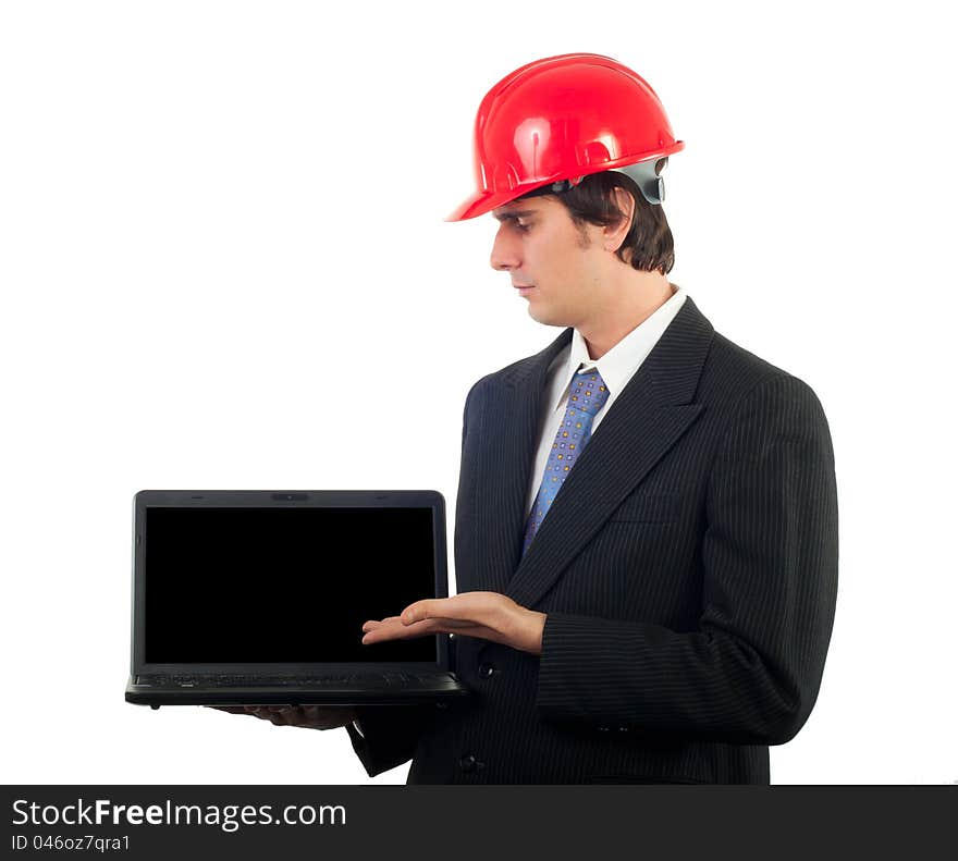 Young engineer in business suit and with red helmet on his head showing your content on the notebook isolated on white. Young engineer in business suit and with red helmet on his head showing your content on the notebook isolated on white.