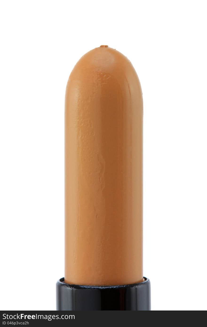 Closeup photo of a concealer stick to conceal under-eye circles or facial blemishes, isolated on white