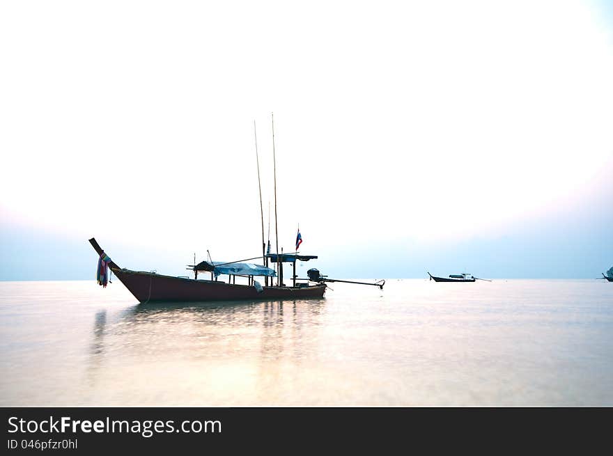 Silhouette fishing boat in the morning at Surin island national park in Thailand