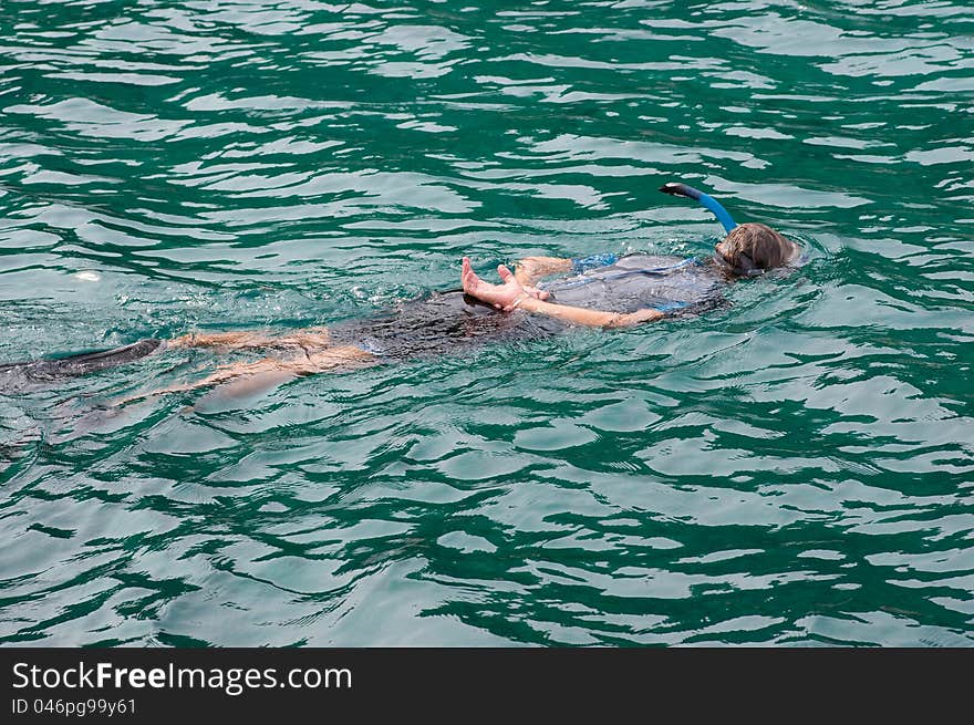 A mand is driving with in the sea. A mand is driving with in the sea