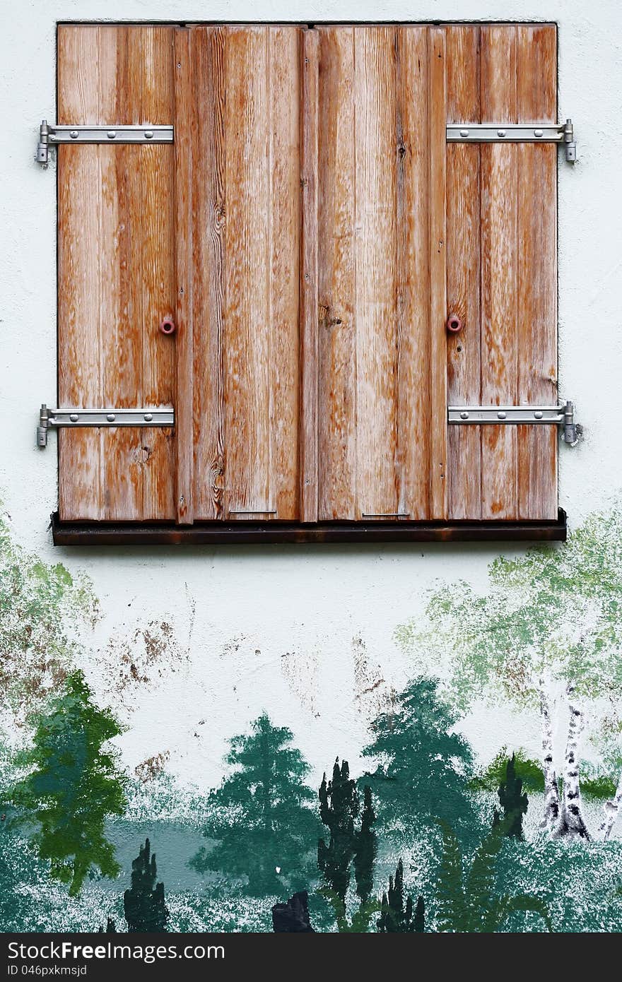 Old wooden framed window with shutters closed. Old wooden framed window with shutters closed