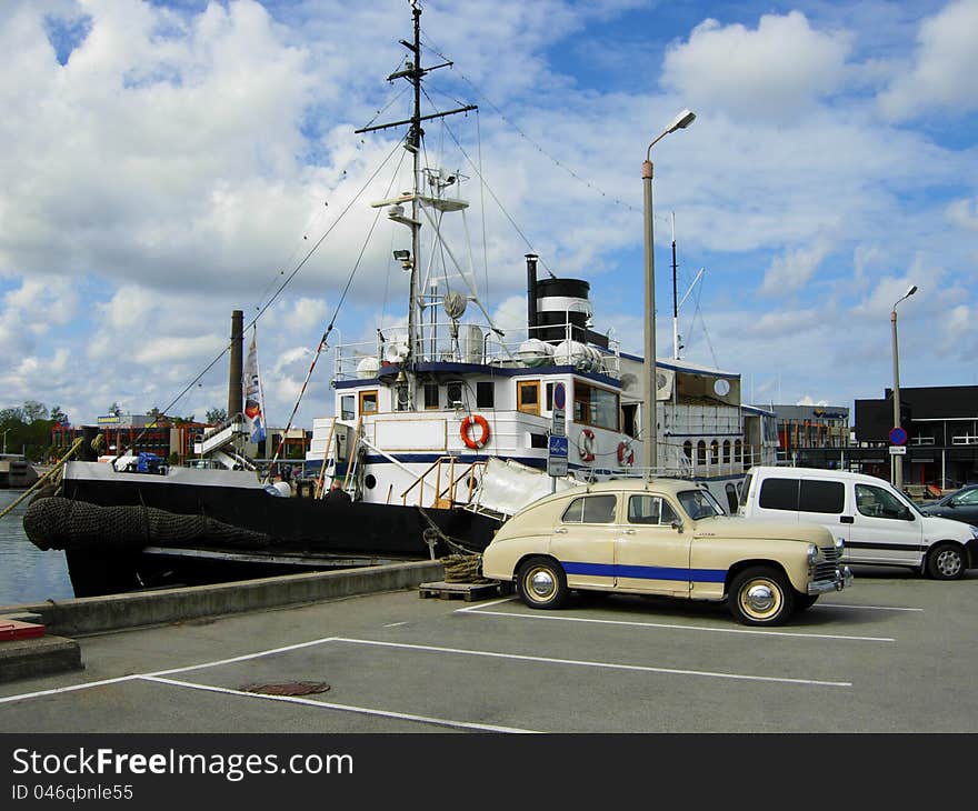 The old tugboat moored at a port