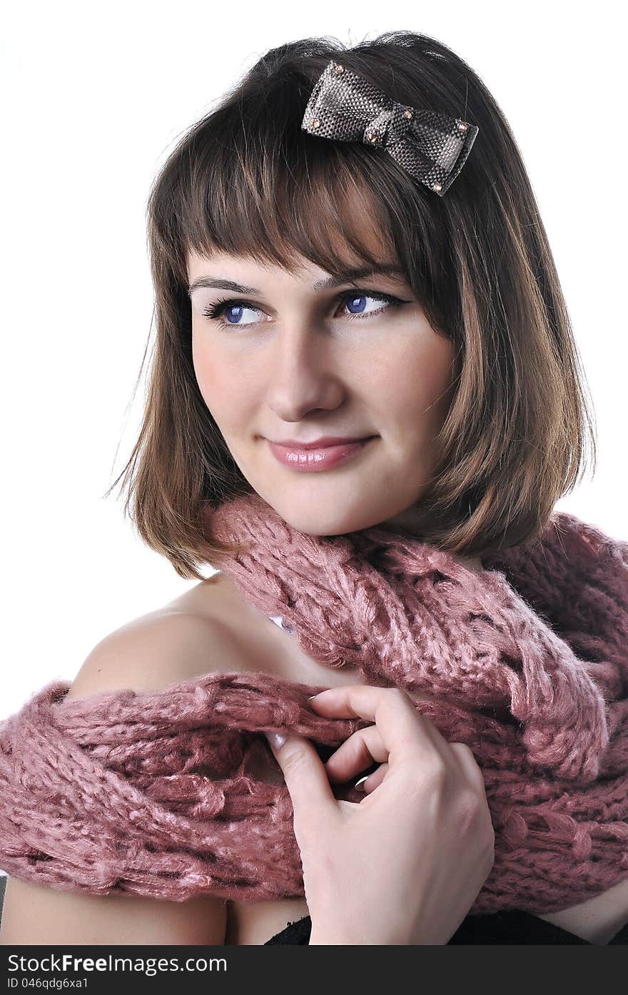 Closeup portrait of beautiful  girl in pink scarf looking to the side. Closeup portrait of beautiful  girl in pink scarf looking to the side