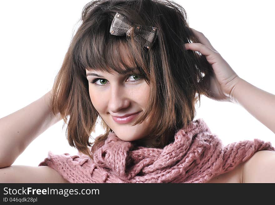 Closeup portrait of beautiful smiling girl in pink scarf