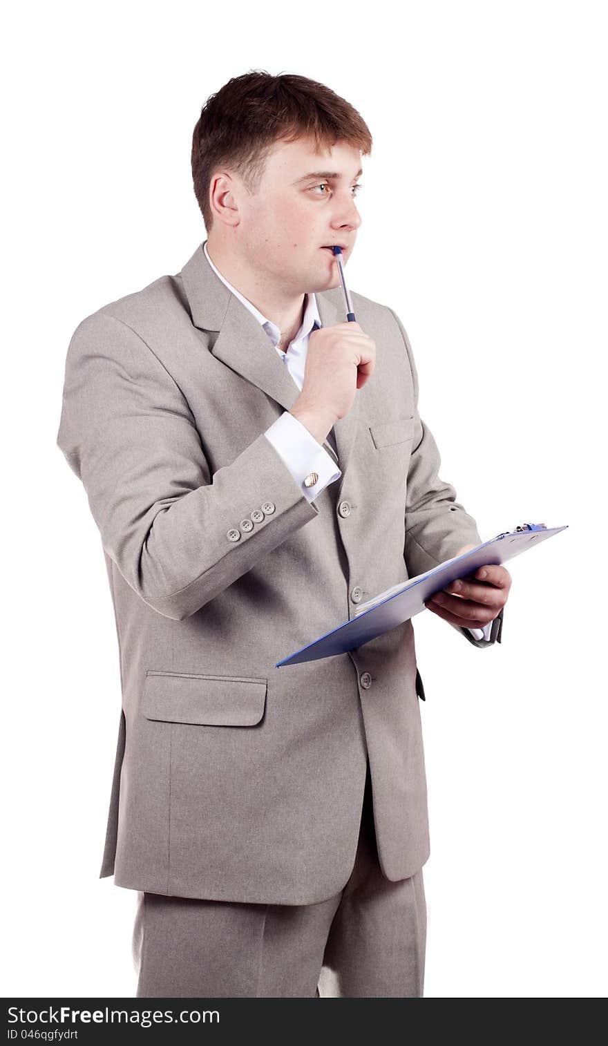 Thoughtful man with a pen on a white background. Thoughtful man with a pen on a white background