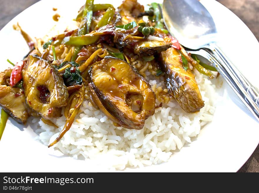 Fried Fish Topped With Spicy Rice.