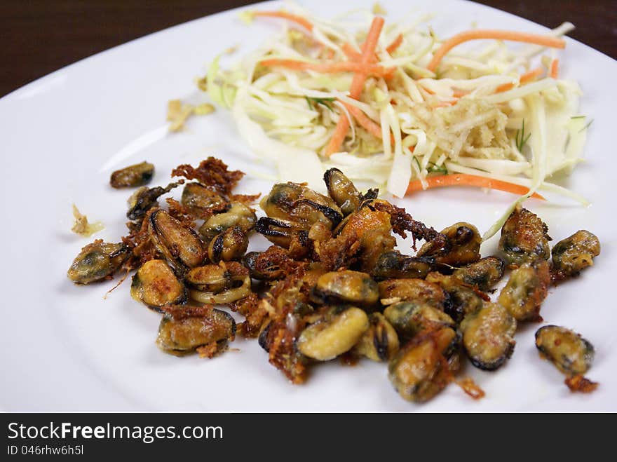 Scallops prepared served with some salad