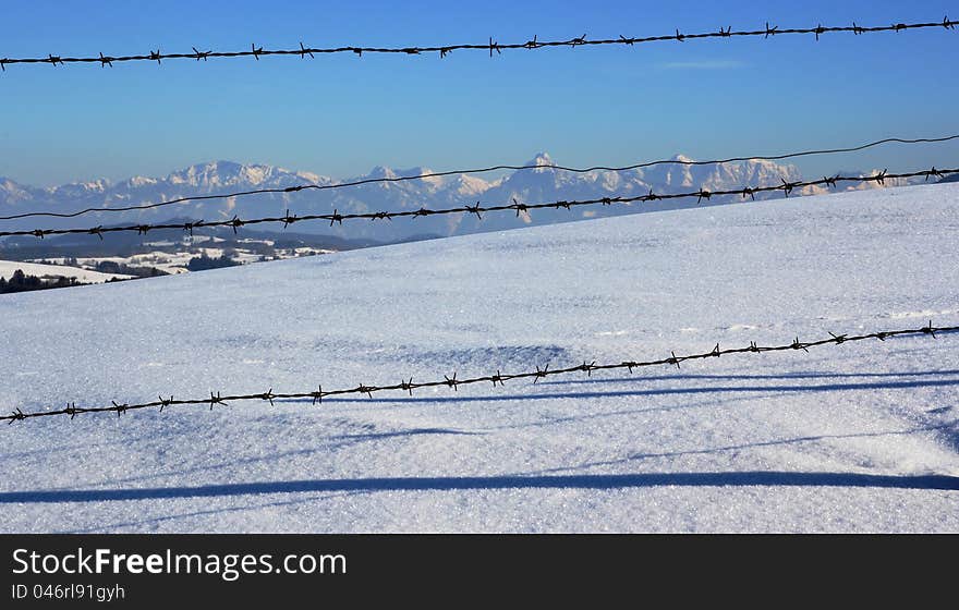 The mountains behind the fence