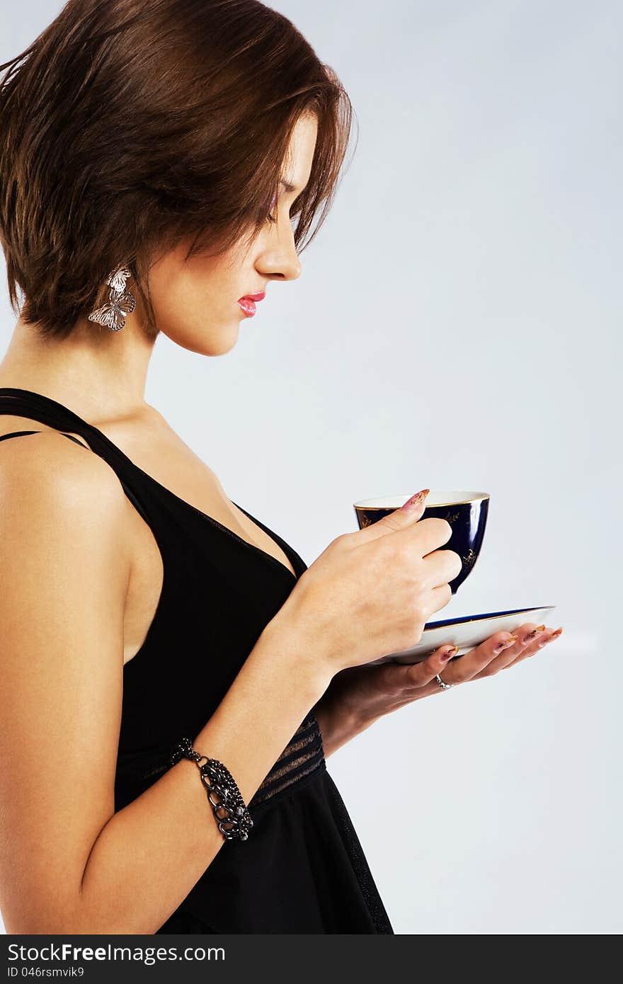 Portrait of a beautiful woman with a cup of tea