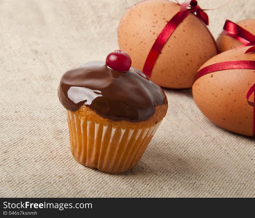 Cupcake with chocolate icing and Easter Eggs. Cupcake with chocolate icing and Easter Eggs