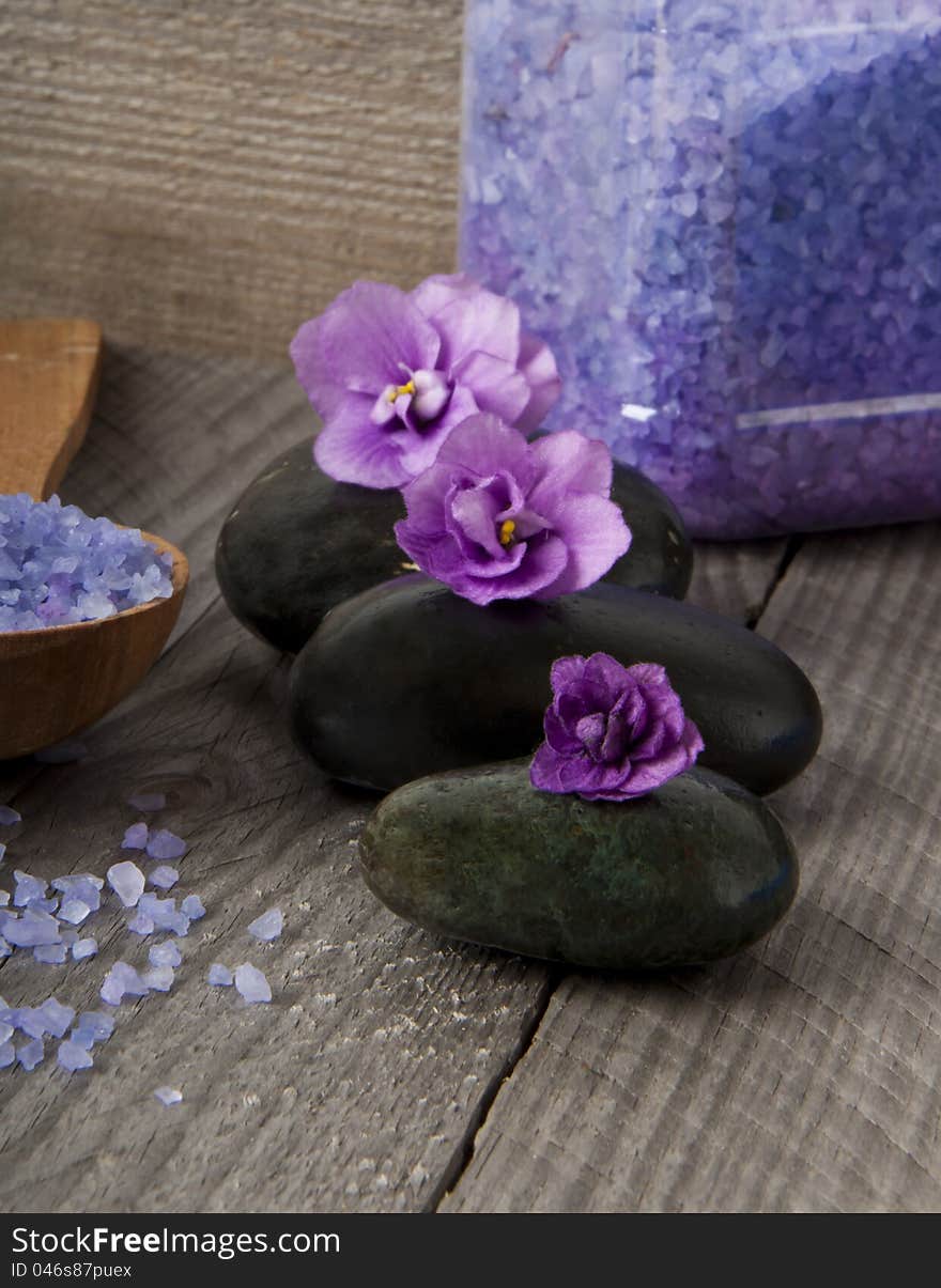 Spa stones with purple flowers