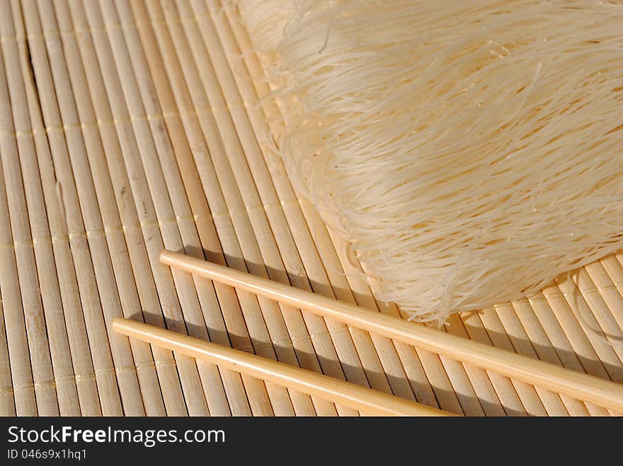 Rice needles on a bamboo place mat