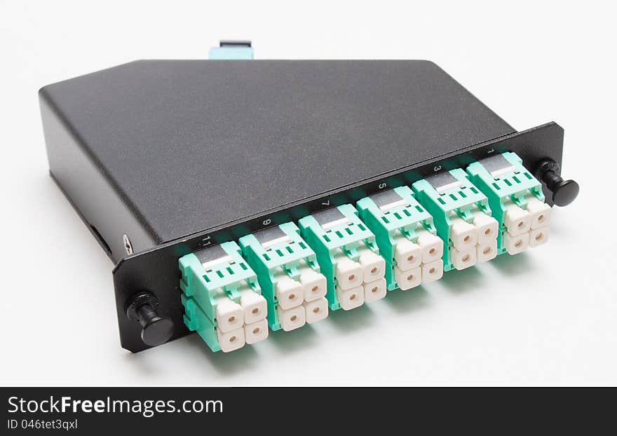 Fiber optic cassette with green singlemode LC connectors. Fiber optic cassette with green singlemode LC connectors
