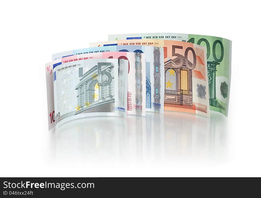 Few European bank notes standing on white background with reflection. Clipping path is included. Few European bank notes standing on white background with reflection. Clipping path is included