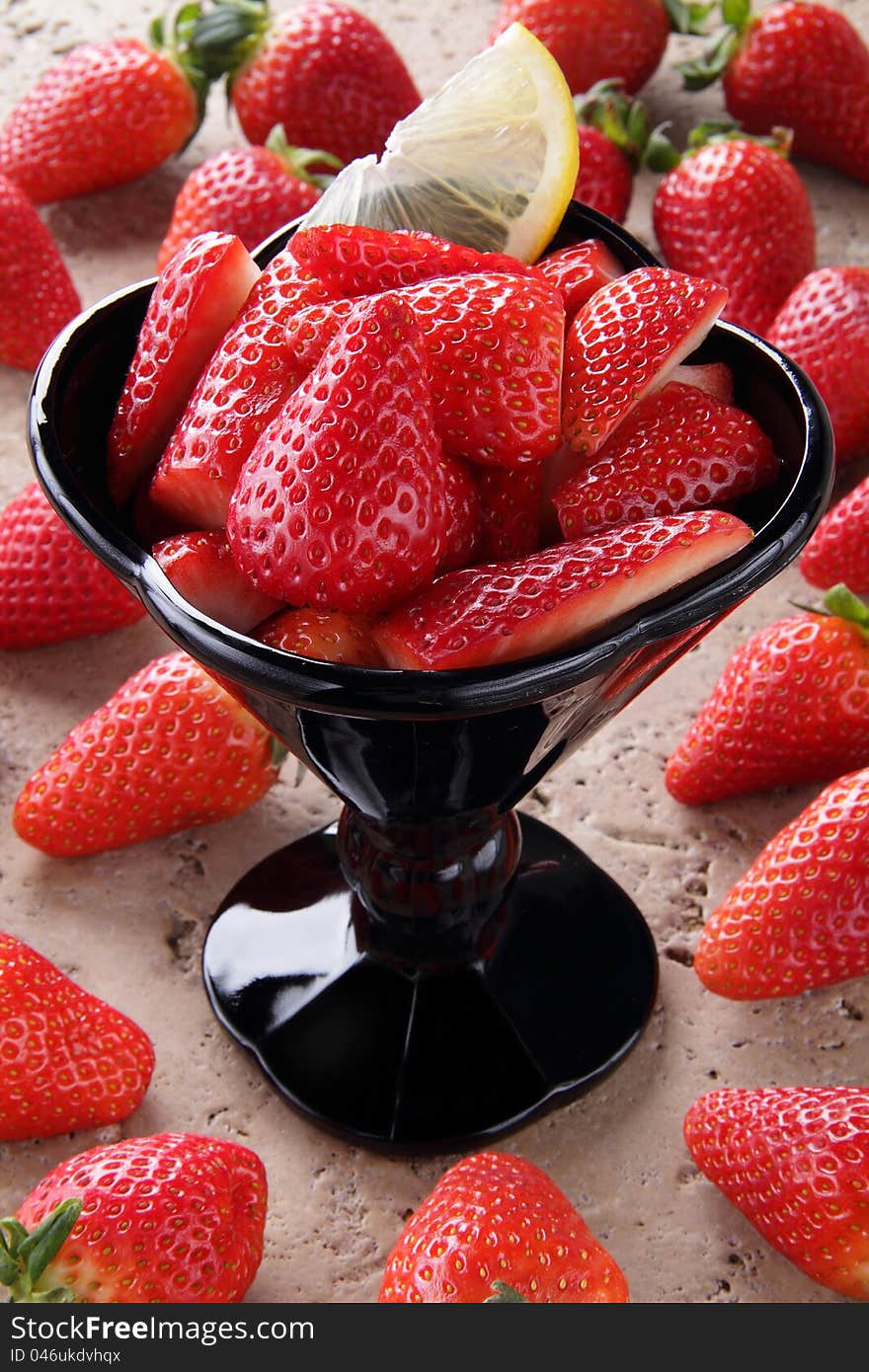 strawberries cup on the stone table