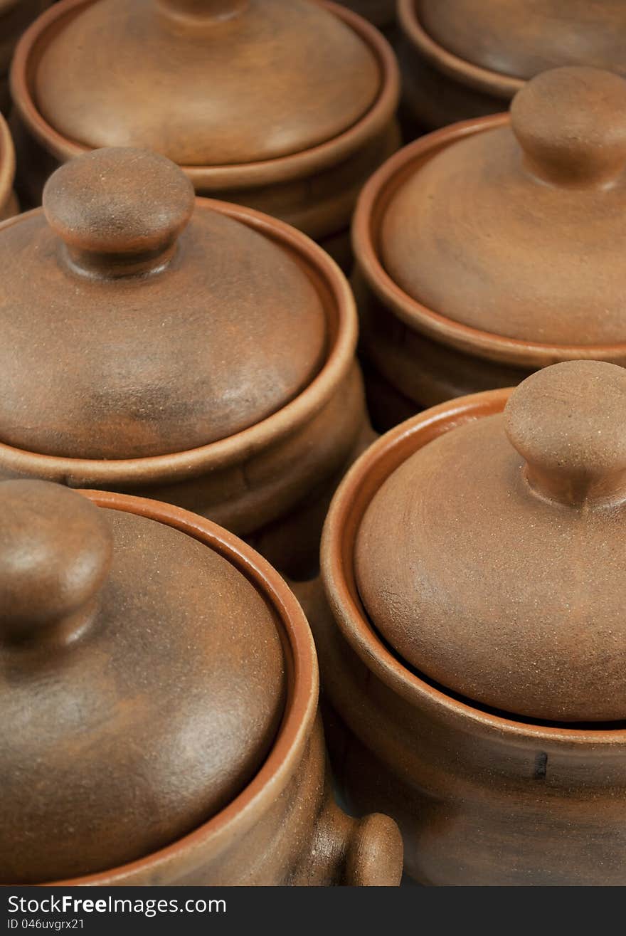 Rows of clay brown pots. Rows of clay brown pots